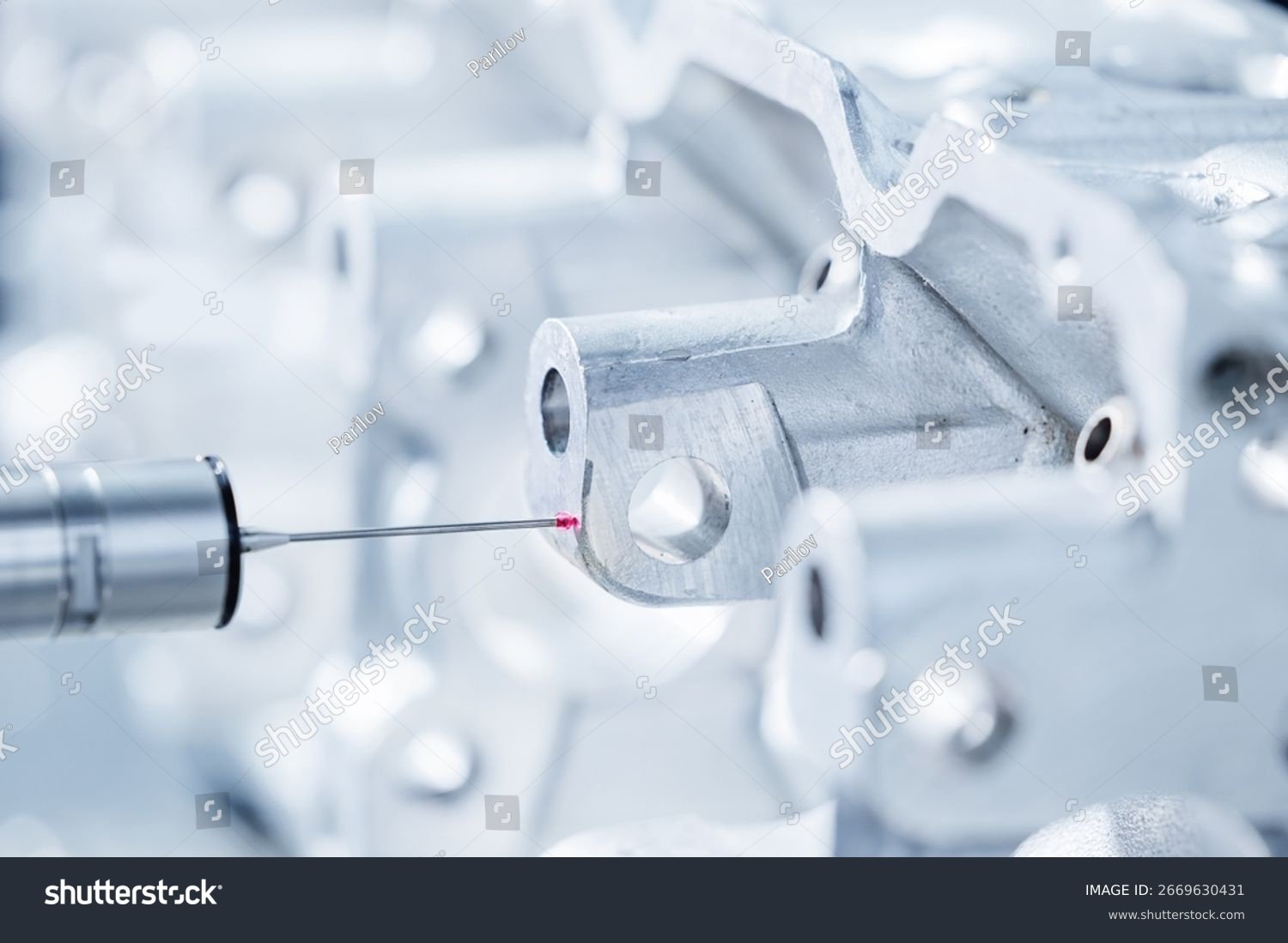 stock-photo-cnc-coordinate-measuring-machine-inspecting-engine-component-2669630431